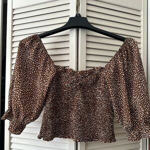 Kittenish cropped off shoulder top